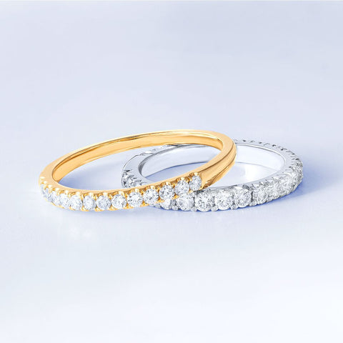 Pave and Carponia set diamond eternity bands in yellow and white gold.