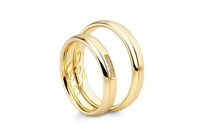 Par de argollas de matrimonio "Secret Promise" en oro amarillo de 14k