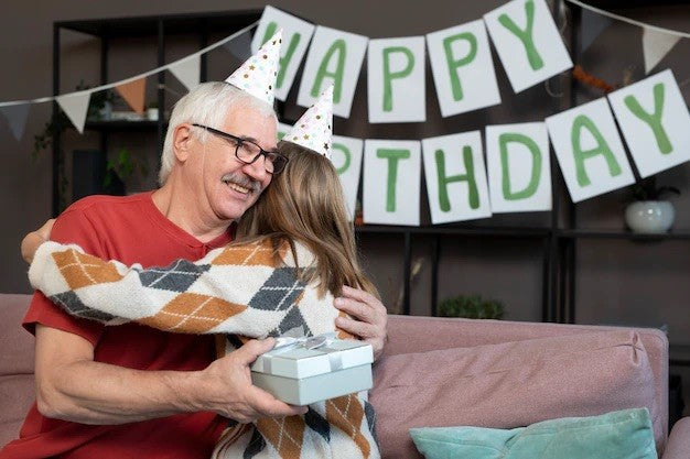 girl and grandpa celebrating birthday