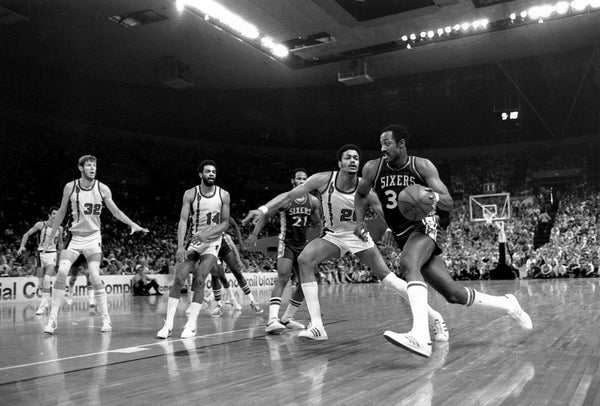Blazers forward Maurice Lucas (20) defends 76ers forward George McGinnis (30) as teammates Bill Walton (32) and Lionel Hollins (14) look on during Game 4 of the 1977 NBA Finals. -- ROGER JENSEN / THE OREGONIAN/OREGONLIVE