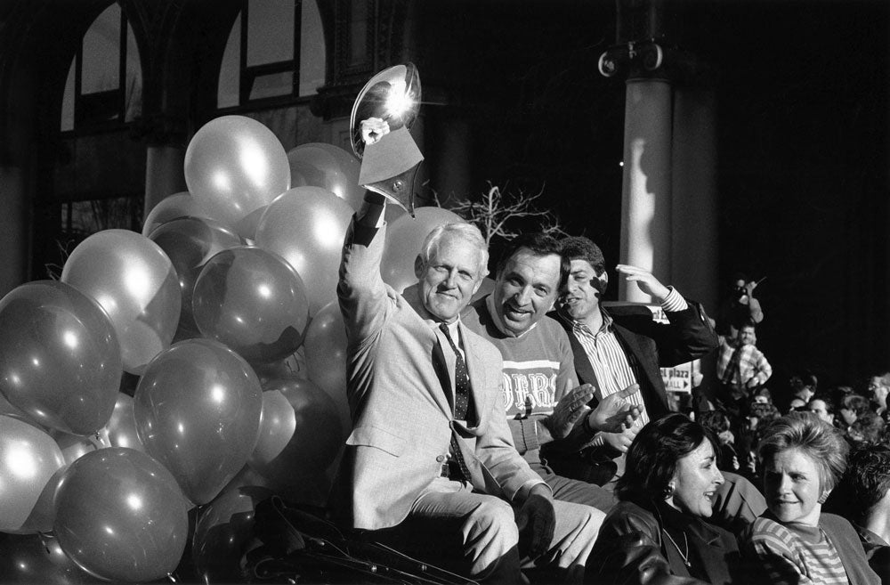 Head coach Bill Walsh, San Francisco Mayor Art Agnos and 49ers owner Eddie DeBartolo proudly display the Super Bowl XXIII trophy along the parade route on Market Street in San Francisco on Jan. 23, 1989. BRANT WARD / THE CHRONICLE