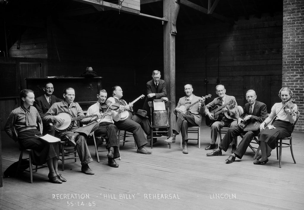 A FERA "Hill Billy" orchestra practices at Randolph School, circa 1935. Among the instruments used are fiddles, guitars, banjos, and a washboard. It is led by assistant supervisor, Montgomery "Skip" Dean. -- Nebraska State Historical Society