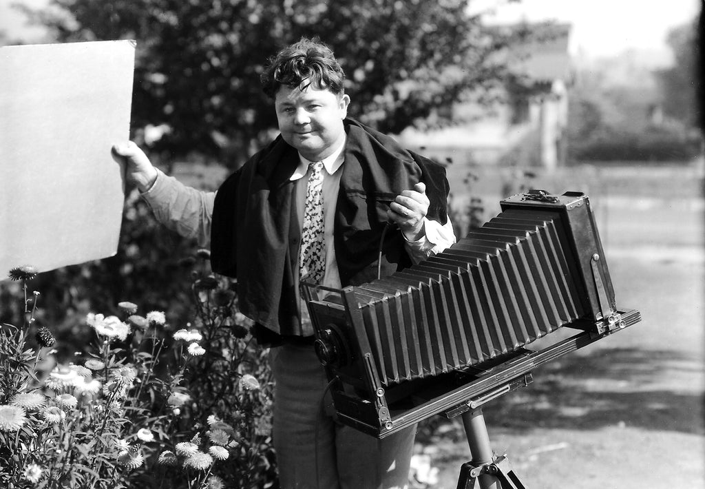 A self-portrait of renowned Woodland photographer Paul W. Hollingshead in 1932. For this photo, Paul had two identical cameras and the squeeze bulb and rubber hose in his hand was connected to the second camera taking this photo. -- Courtesy Bill and Edward Hollingshead; photo by Paul W. Hollingshead