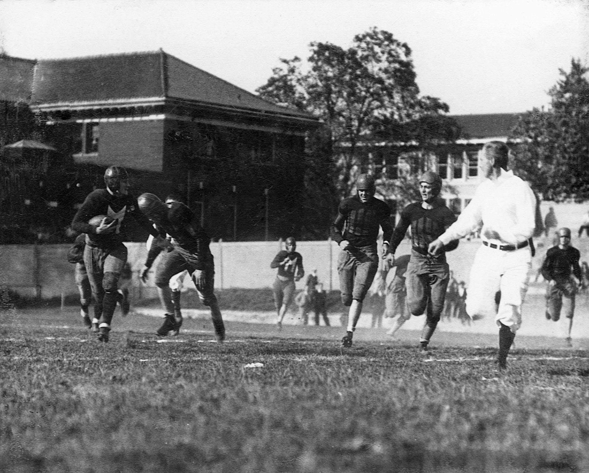 Meadville High School running back Ford “Duffy” Weber, left, breaking away in a 48-0 victory over Warren at Montgomery Field, Allegheny College, 1929. -- Courtesy of Mark Duff Weber