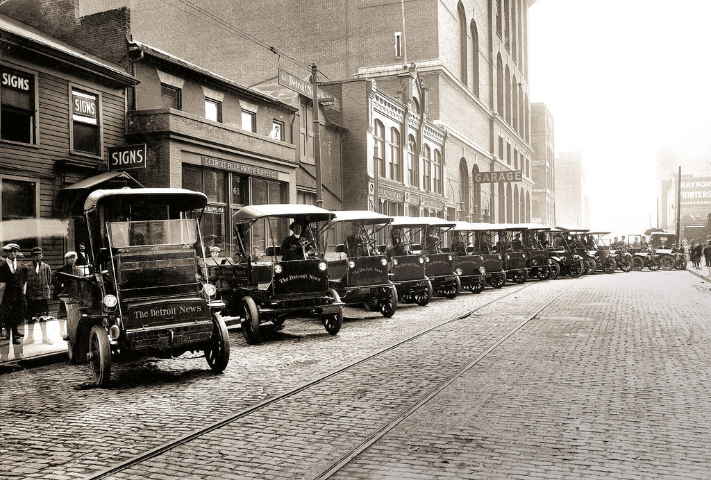 The cover image, courtesy of The Detroit News Photo Archive, features a fleet of Detroit News trucks lined up on Congress, looking west, between Shelby and Wayne (now Washington Boulevard), circa 1912–14.