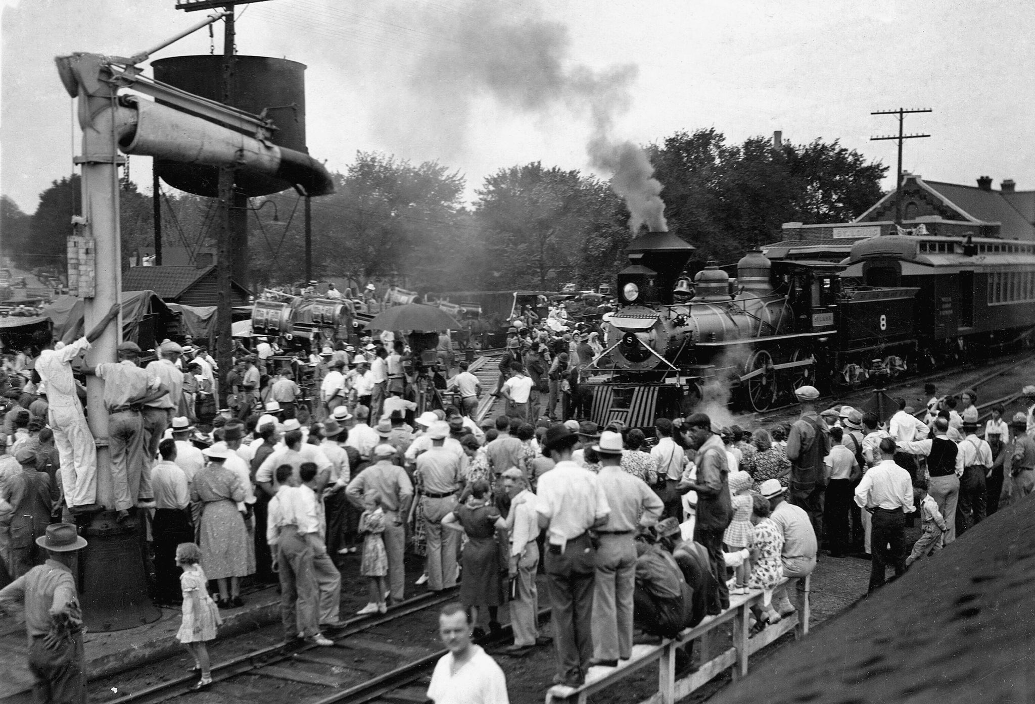 Spectators watch the robbery scene for Jesse James, which was filmed at the train station in Southwest City, 1938. -- Courtesy of Deanna Booyer, Newton County Historical Society & Park