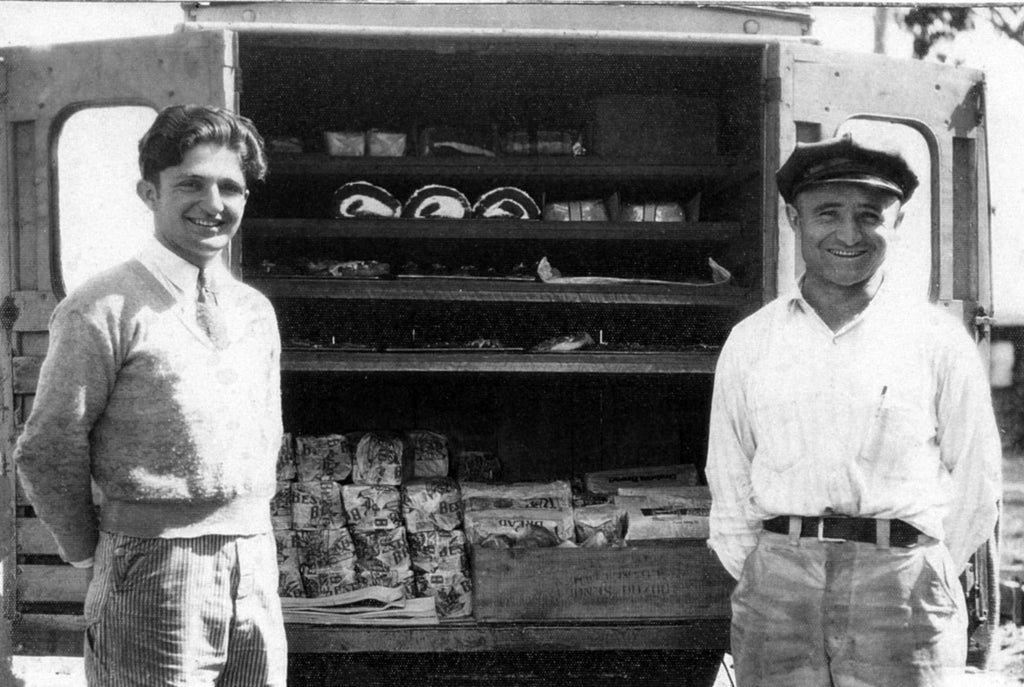 Bruno Lenzi, left, and Charles Passini, right, behind a Passini Bakery delivery truck with products for local stores, 1405 Georgia Street, circa 1933. -- Courtesy Arlene Passini