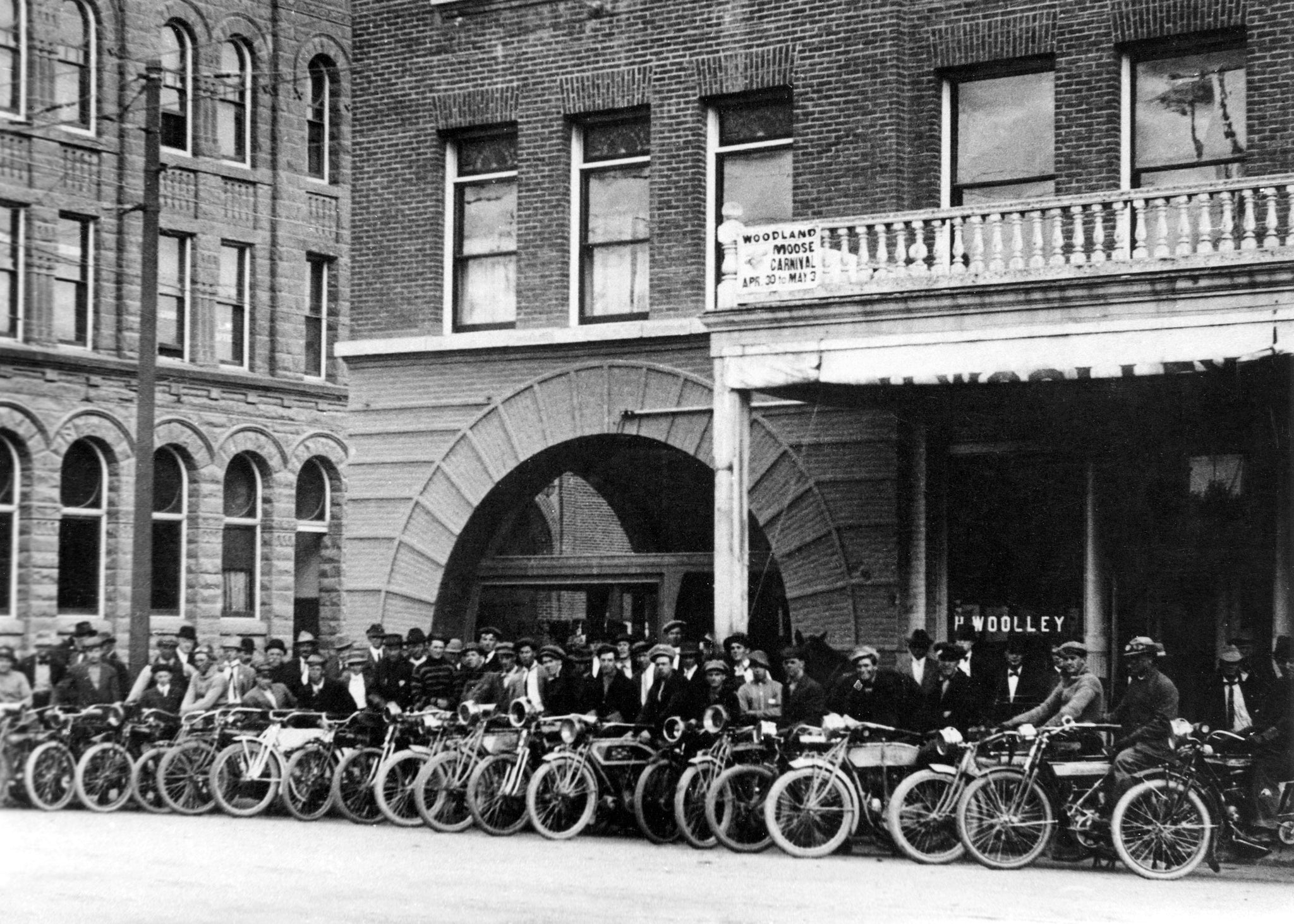 The Yolo County Motorcycle Club in front of the Hotel Julian at the northeast corner of Second and Main Streets, Woodland, 1919. -- Courtesy of the Yolo County 