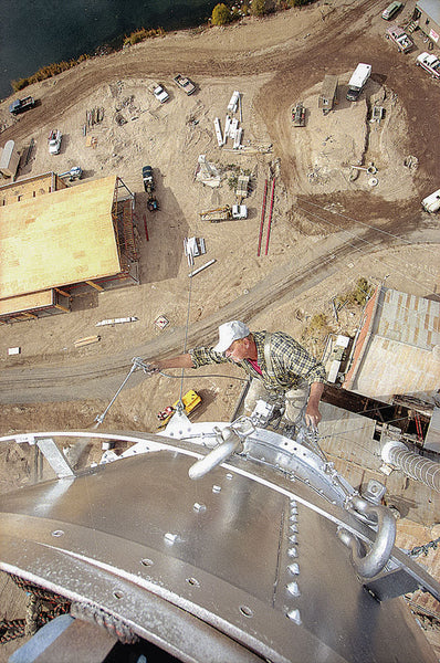 Jerry Morris paints a smokestack in October 2000.