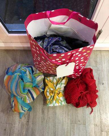 Reused gift bag and scarf-wrapped gifts