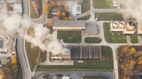 White smoke coming out of industrial buildings