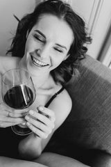 Smiling woman with wine glass