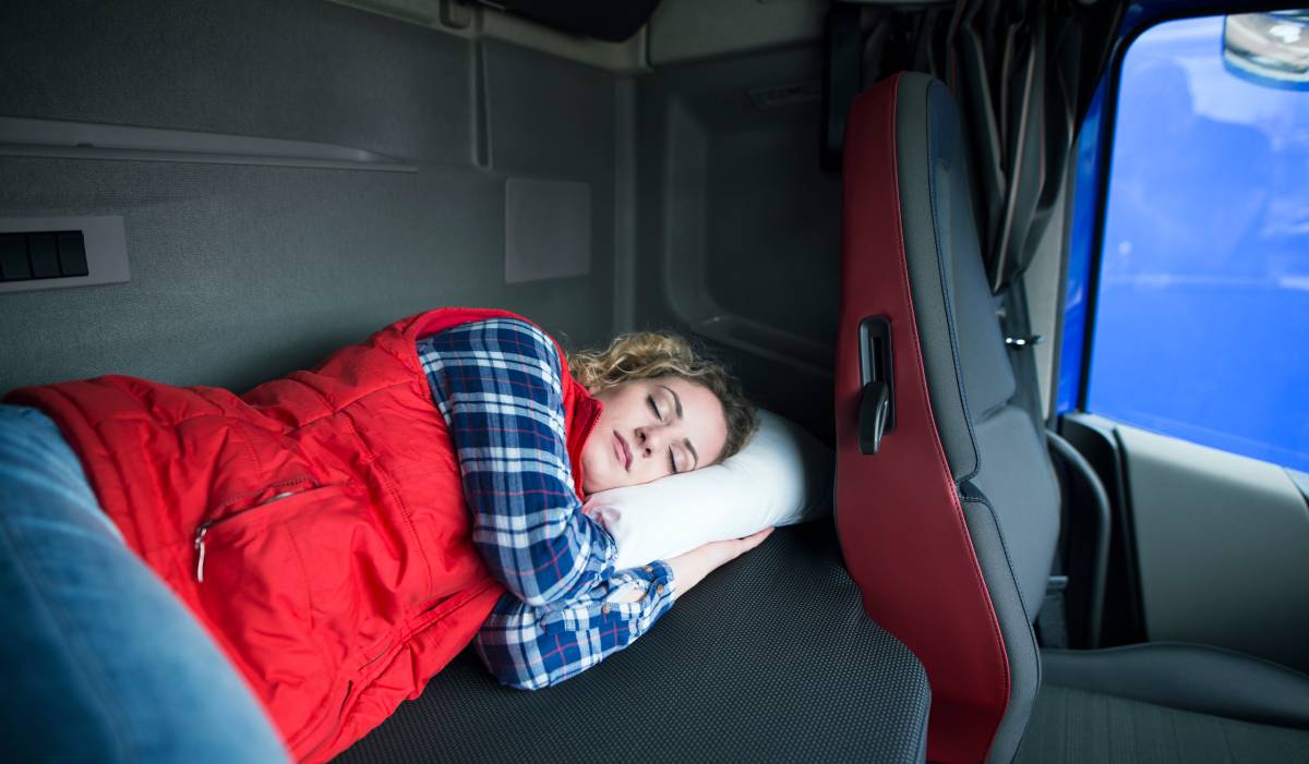 Woman sleeping on Mattress back of truck