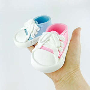 pink and blue baby shoes