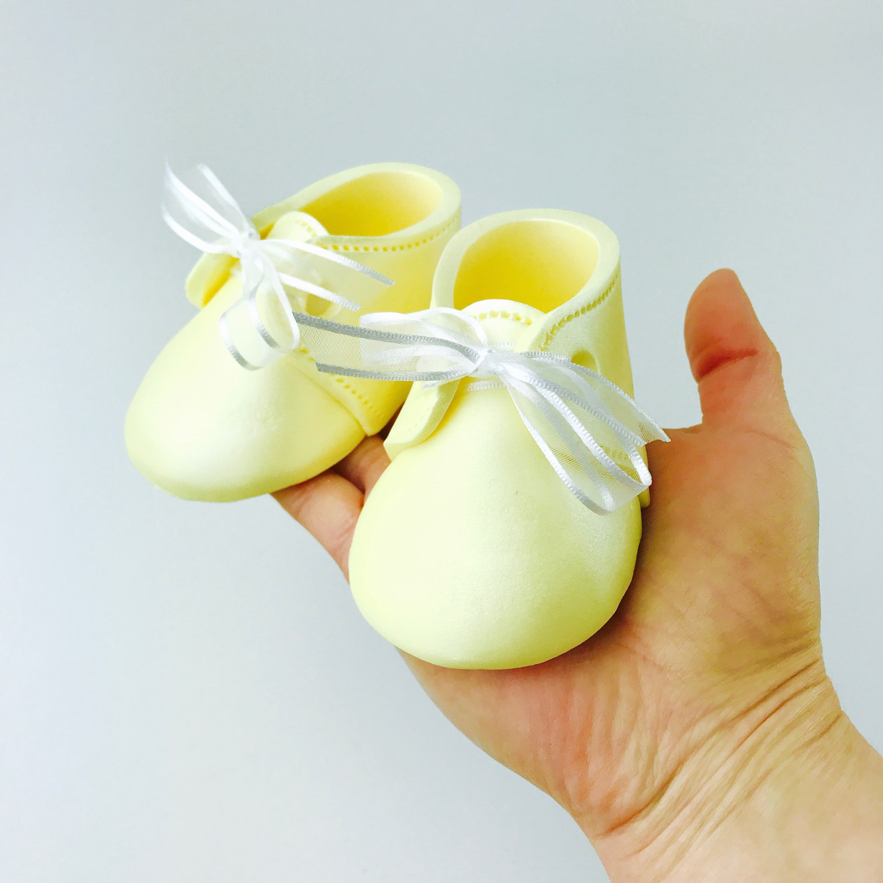 yellow baby shoes