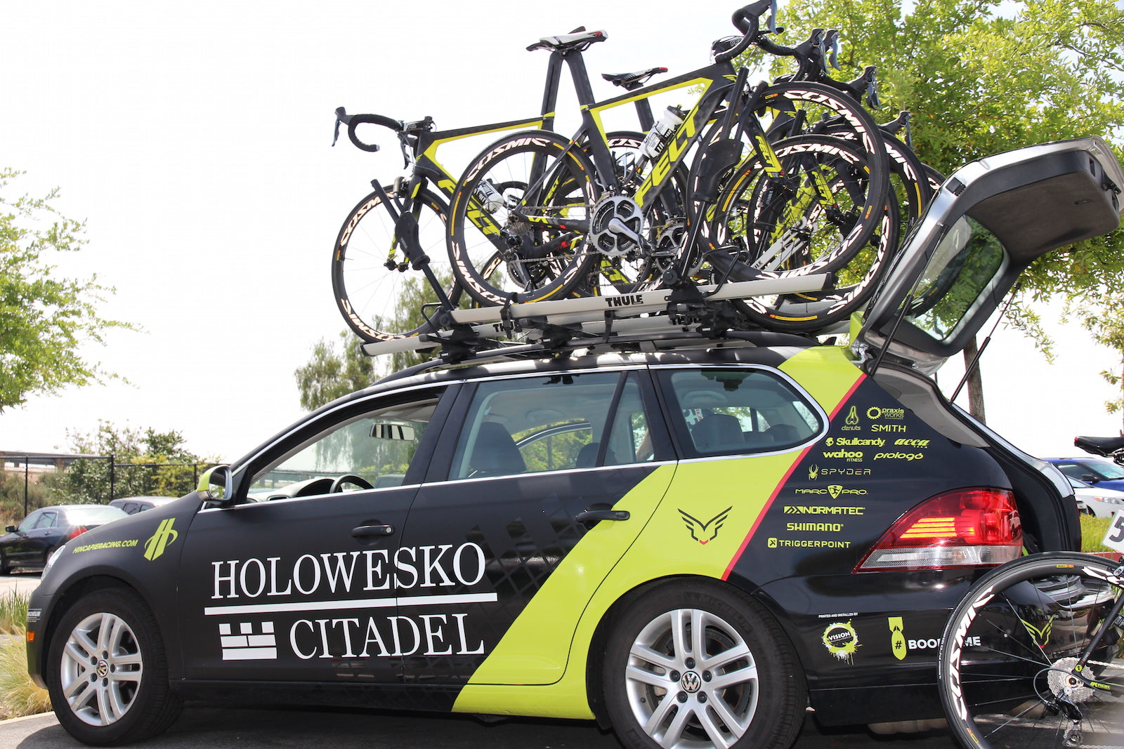 bicycles on top of team car race