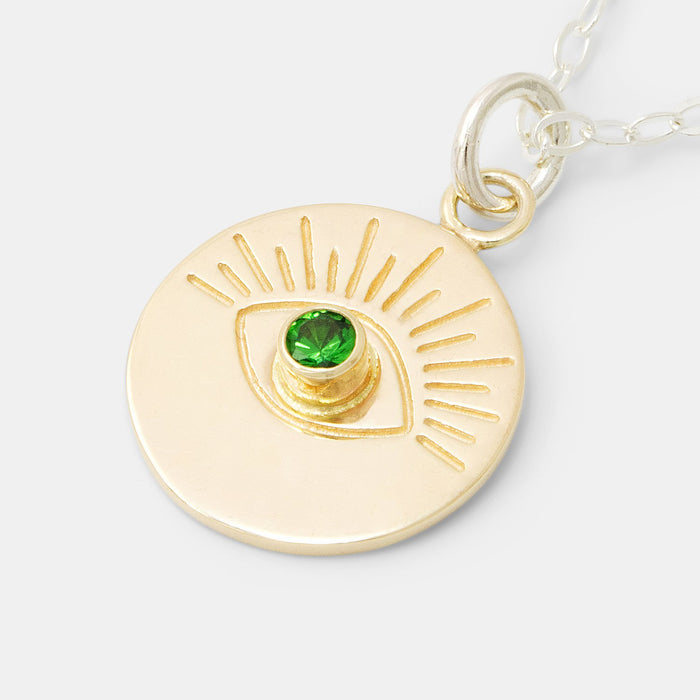 Solid gold evil eye pendant on silver chain