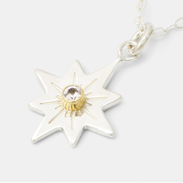 Guiding star necklace in silver, gold and white sapphire