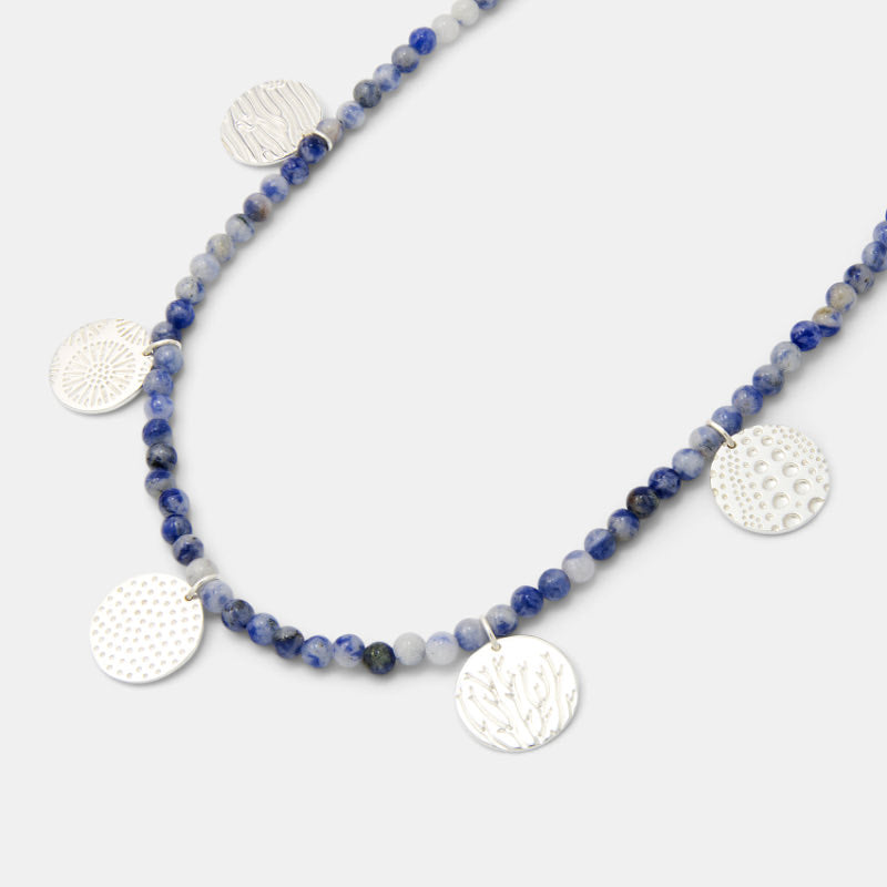 Shop for gemstone beaded necklaces, including this ocean textures necklace in silver.