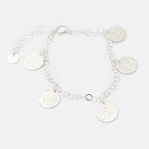 Ocean textures sterling silver charm bracelet