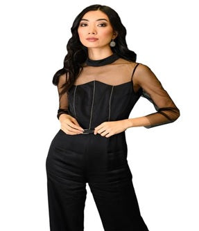 A woman wearing a jumpsuit