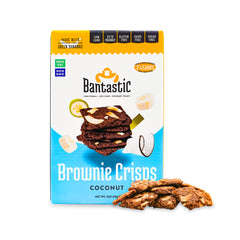 blue and white box of bantastic brownie crisps with a pile of Bantastic coconut brownie crisps outside the package showing crisp keto brownie texture