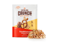 package of Catalina Crunch Savory Keto Snack Mix, traditional flavor with a pile of Catalina Crunch Keto Snack mix outside of the package. The keto snack mix contains cashews, keto pretzels, pecans and catalina crunch cereal 