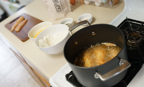 Chicken tenders frying in pot