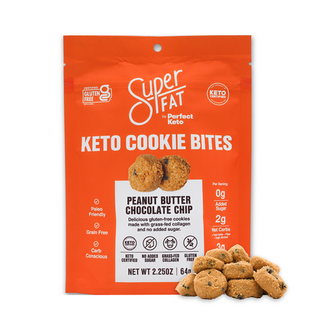 White and orange package of Super Fat Peanut Butter Chocolate Chip Keto mini cookies on a white background with a pile of peanut butter chocolate chip keto mini cookies surrounding it. 