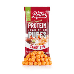 Pile of Better Than Good grab n' go protein puffs in Tangy BBQ flavor in front of the red and white better than good snack packaging