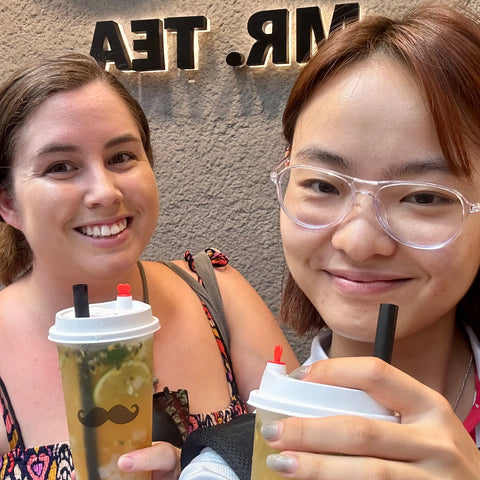 Niina and Nicole drinking Bubble Tea in Causeway Bay