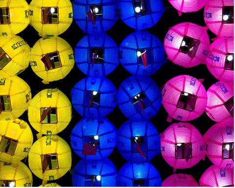Colourful lanterns in yellow blue and pink 