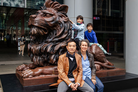 Family photo with the Hong Kong HSBC Lion in Central Hong Kong