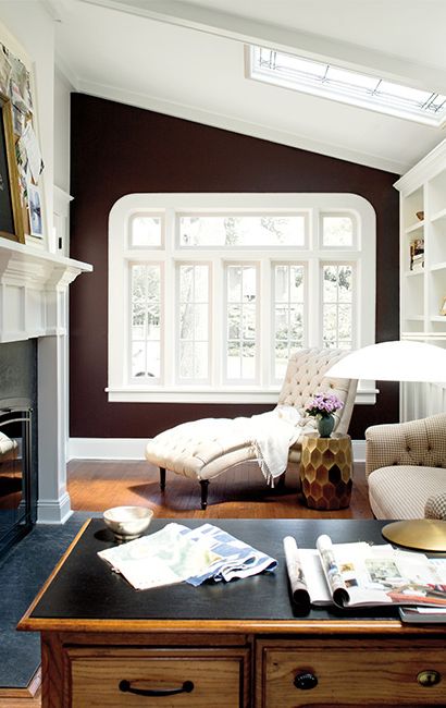 Accent wall painted brown creating contrast from the rest of the room.