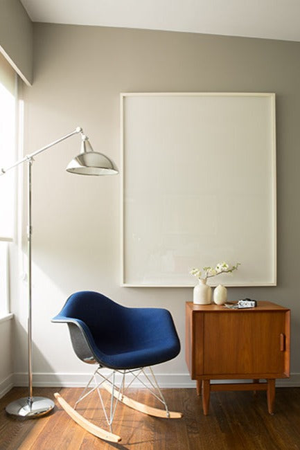 A calming room corner with neutral colors and modern accents