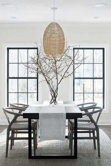 A modern dining area with Paper White OC-55 walls and ceilings painted with Distant Gray OC-68.