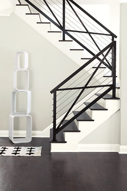Modern staircase framed by white walls painted with Paper White OC-55.
