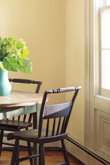 A sunny dining area corner painted in Soleil AF-330.