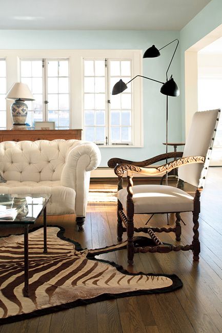White living room with hardwood floors and mixed style