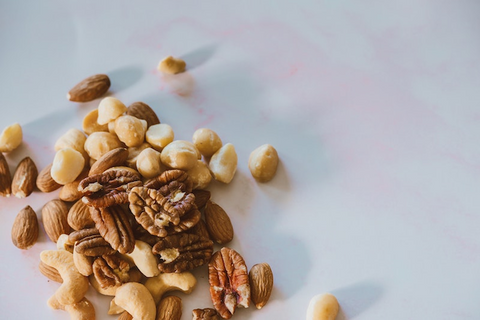 A photo of nuts on a white surface 