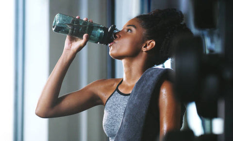 An athlete drinking some water 