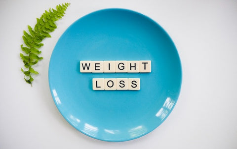 Weight loss text on a blue plate 