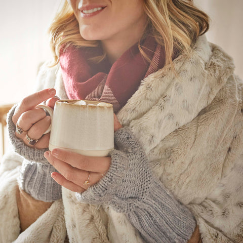 A woman holding hot chocolate