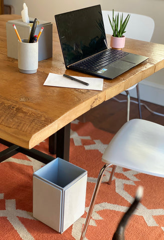 A desk with DKNY Grey Wood accessories