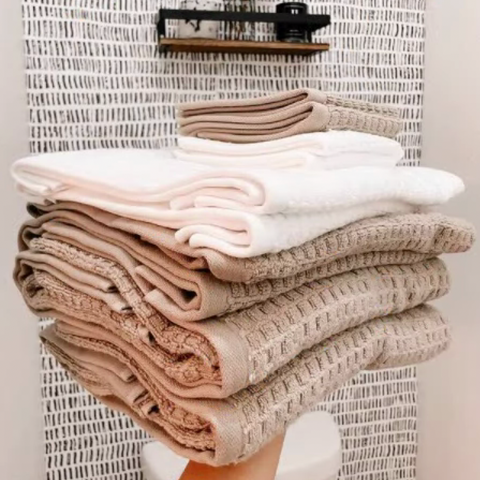 Stack of fresh, soft DKNY Quick Dry towels.