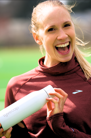 Laurie Barton holding the Lyvecap bottle