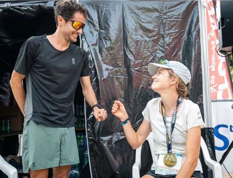 Photo of Katie schide getting congratulated after a race