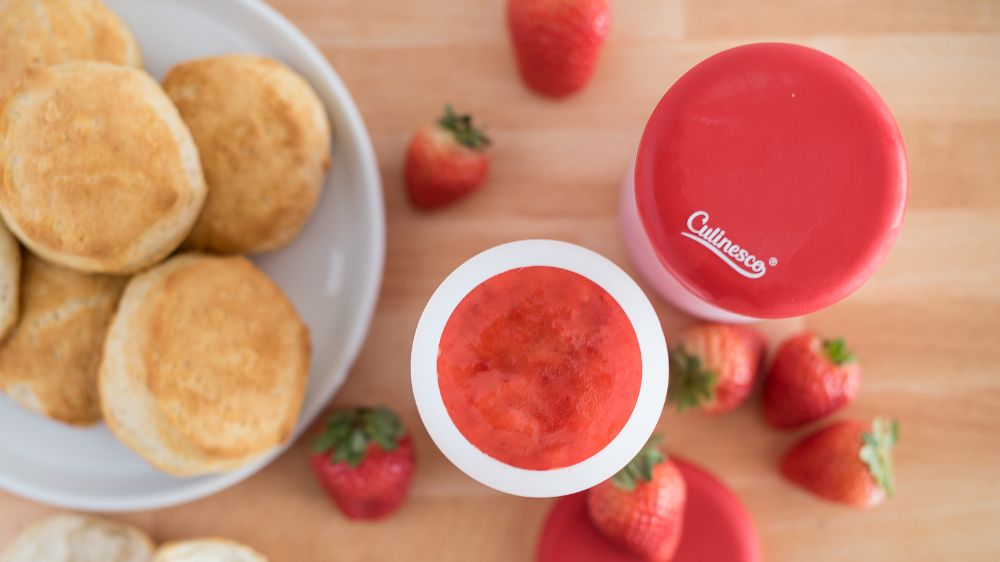 Strawberry jam in a silicone freezer jar.