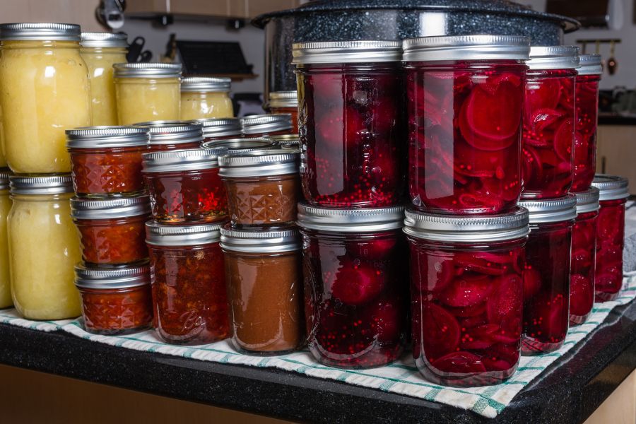 Stacks of home preserves in mason jars