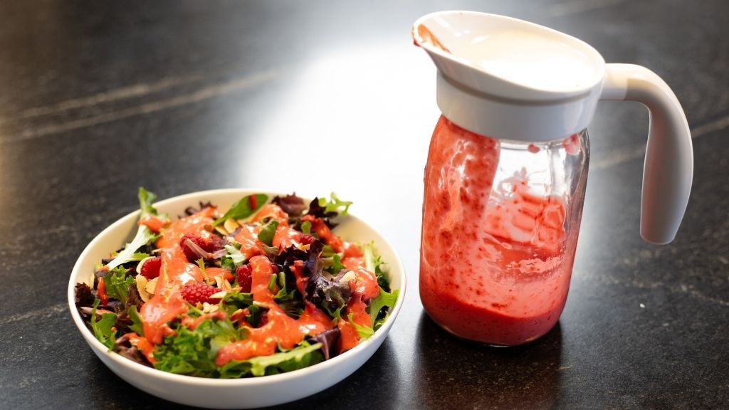 Salad in bowl and mason jar with dressing and Ergo Spout for pouring